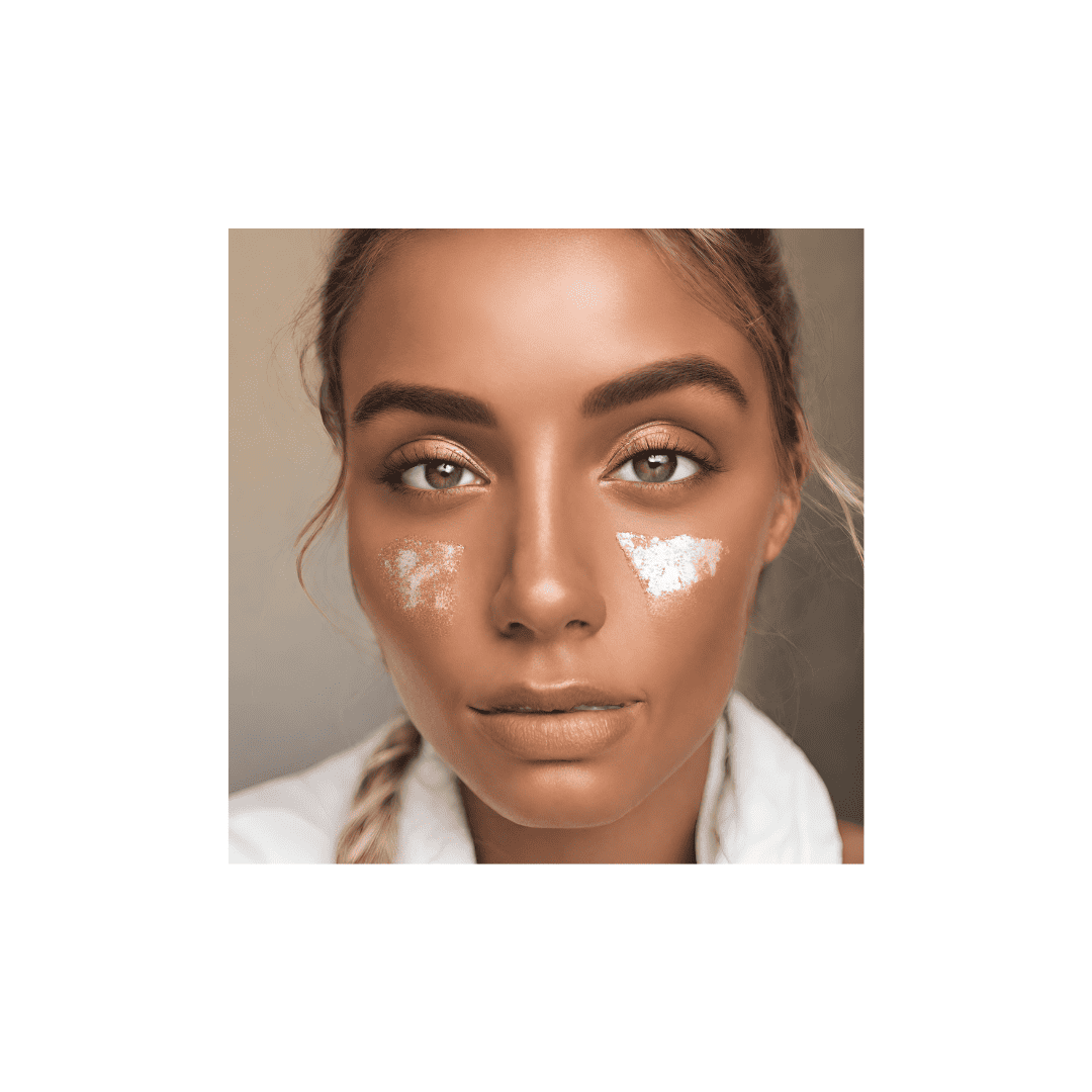 A person with glowing skin, showing the effects of Drunk Elephant Bronzing Drops